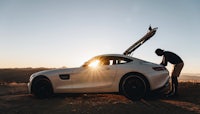 mercedes amg sports car at sunset